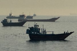 Vessels are seen anchored in the Strait of Hormuz, off the port city of Khasab on Omans northern Musandam Peninsula on May 17, 2026. Washington, locked in conflict with Tehran since US and Israeli forces launched major strikes on the Islamic republic beginning February 28, has struggled to break an impasse and make any progress toward ending a war that has shaken the Middle East and sent energy prices climbing. The war has led to an effective blockade of the critical Strait of Hormuz, through which some 20 percent of global oil exports pass in peacetime, and has drawn neighbors Israel and Lebanon into a deadly side conflict. (Photo by AFP) /