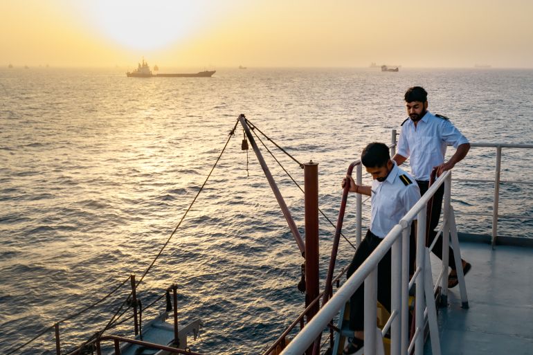 MUSCAT, OMAN - JUNE 23: Indian sailors go about their day after being stranded onboard their cargo vessel for days as congestion at Port Sultan Qaboos has prevented them from docking, leaving the ship anchored off the coast of Oman around Qaboos Port on June 23, 2026 in Muscat, Oman. The cargo vessel carries sugar and wheat. The Strait of Hormuz, a vital shipping route for the region's oil and gas, was effectively blockaded since the outbreak of war between the United States and Iran in late February. This week's provisional peace deal between the countries was meant to reopen the waterway to shipping traffic, but the pace of that reopening is unclear amid continued fighting in Lebanon and the need to clear the Strait of sea mines. On Sunday, U.S. Vice President JD Vance arrived in Switzerland for high-level talks with the Iranian delegation, as the two sides seek to clarify the terms of ending the war. (Photo by Elke Scholiers/Getty Images)