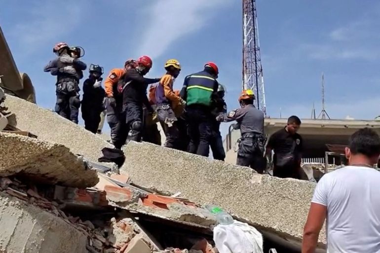 Emergency personnel rescue a person from the rubble of a collapsed residential building following an earthquake in Caraballeda, La Guaira, Venezuela, June 25, 2026 in this screengrab taken from a social media video. @murata_coco via instagram/via REUTERS THIS IMAGE HAS BEEN SUPPLIED BY A THIRD PARTY. MANDATORY CREDIT. NO RESALES. NO ARCHIVES. VERIFICATION: -Road layout, buildings, utility tower and business signage matched archive and satellite images -Date confirmed by the source -No older version found posted online before June 25